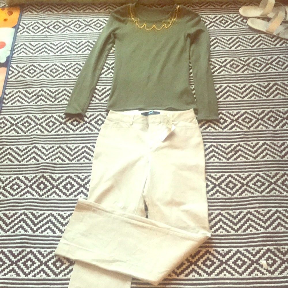 Bejeweled long-sleeve top and khaki pants
